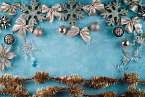 Free photo snowflakes with bows on blue background