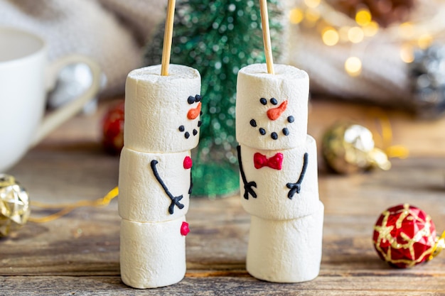 Free photo snowmen made of marshmallows cocoa drink sweet treat for kids