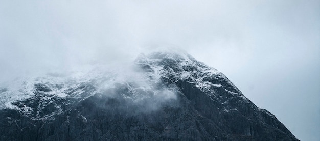 Snowy mountain on a misty day