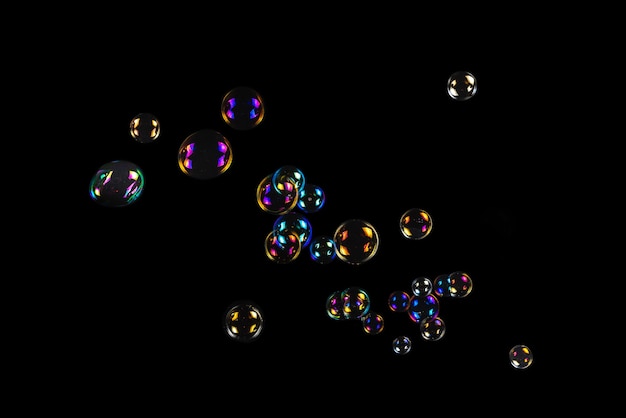 Soap bubbles isolated on a black background. copy space.