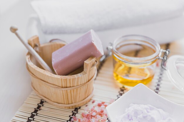 Soap and cream near essential oil