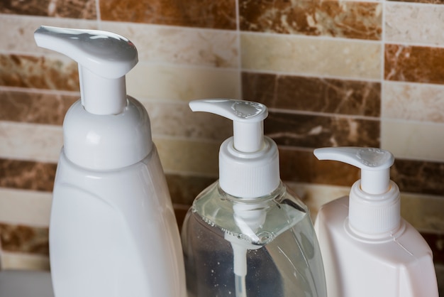 Soap dispenser bottles in bathroom