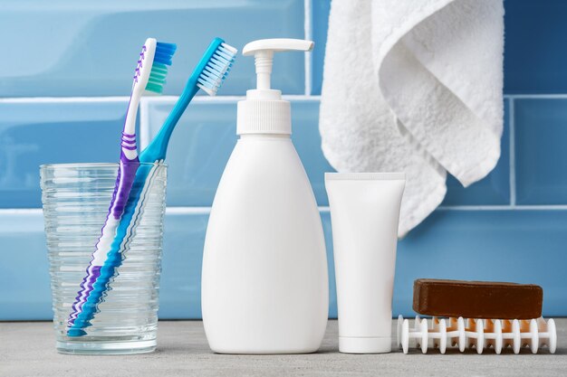 Soap and toiletries on shelf in blue bathroom