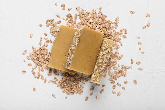 Soap with oatmeals around on table