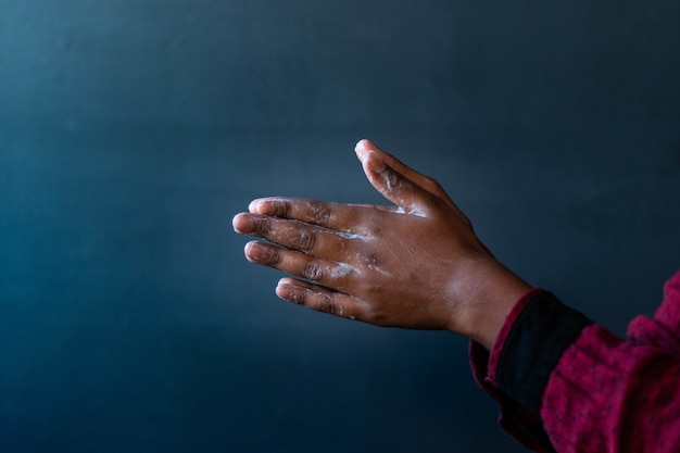 Soaped hands of a person - importance of washing hands during the coronavirus pandemic