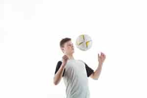 Free photo soccer player controlling the ball with the chest