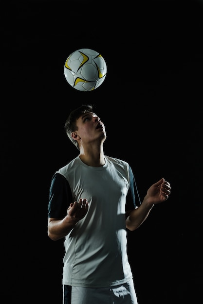 Soccer player hitting ball with head