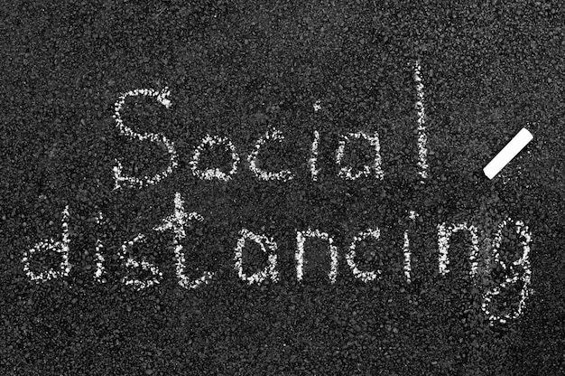 Social distancing concept with chalk