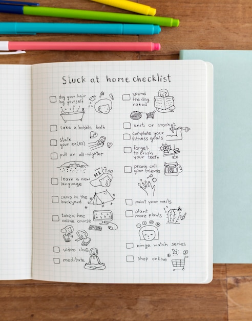 Social isolation doodle style checklist in a notebook