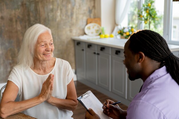 Social worker helping a senior woman