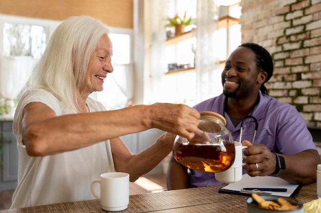 Social worker helping a senior woman