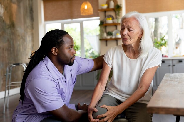 Social worker helping a senior woman