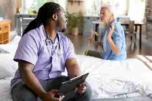 Free photo social worker taking care of a senior woman