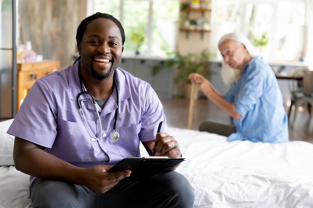 Free photo social worker taking care of a senior woman