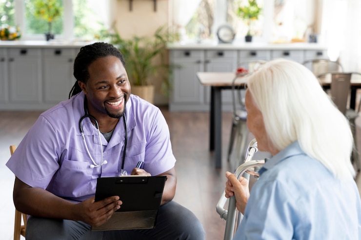 Free Photo social worker taking care of a senior woman