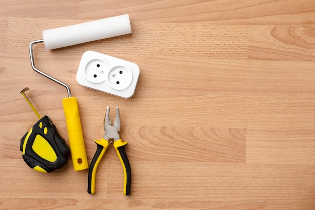 Free photo socket and tools on wooden background