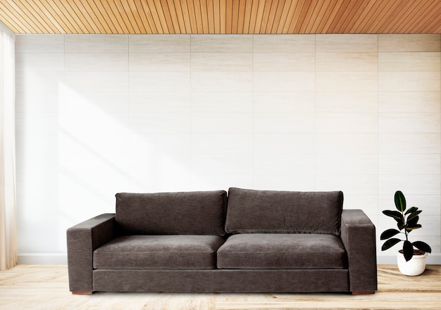 Sofa by a tiled wall