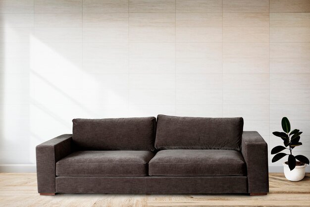 Sofa by a tiled wall