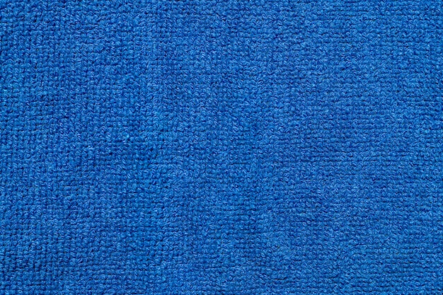 柔らかい青い繊維布生地のテクスチャ背景。