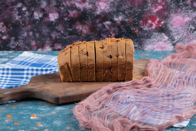 Soft yummy pie with mixed ingredients on wooden board.