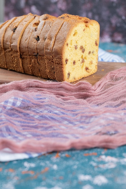 Soft yummy pie with mixed ingredients on wooden board.