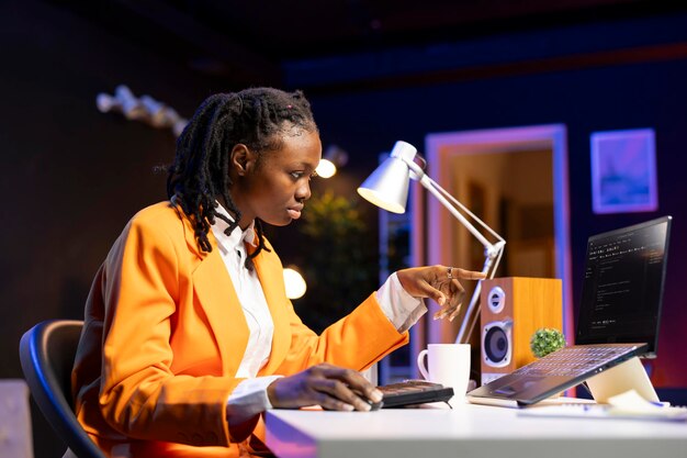 software developer at laptop coding creating program implementing algorithms it expert in home