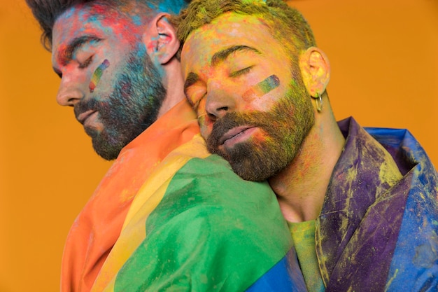 Soiled in paint gay snuggling on boyfriend