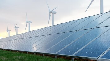 Solar panels and wind turbine on the sky background