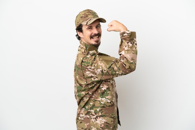 Soldier man isolated on white background doing strong gesture