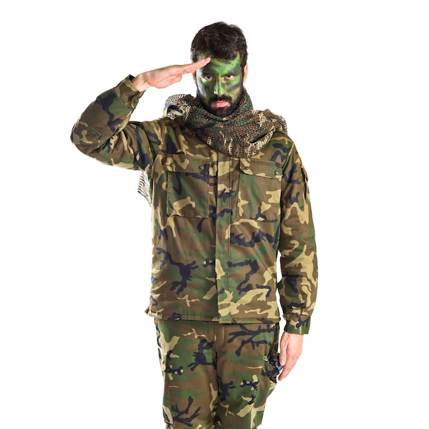 Soldier saluting over white background