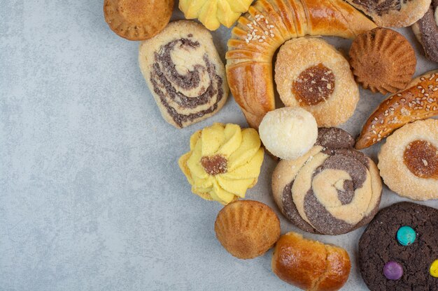 Some of fresh delicious cookies on white table.