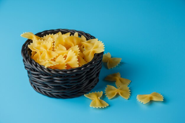 Some macaroni pasta in a black bowl