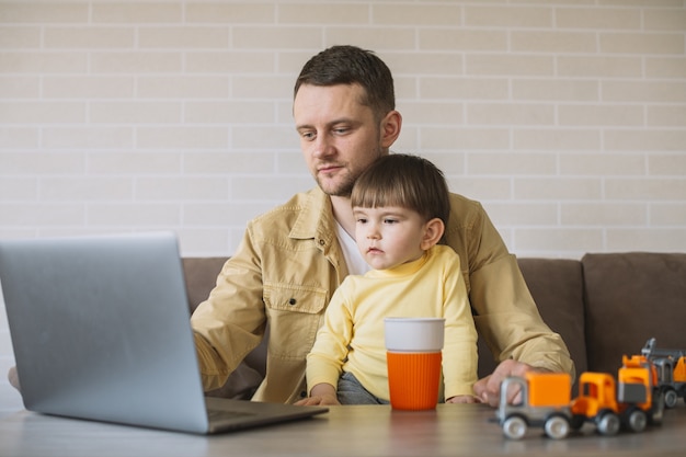 Free photo son staying with father while working from home