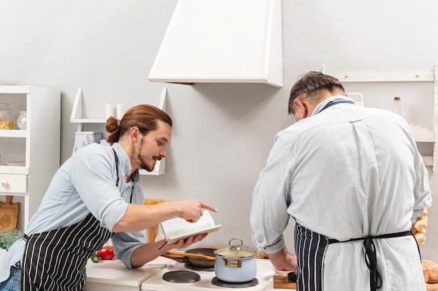 Son telling father how to cook