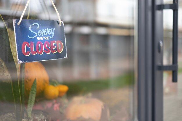 Sorry we're closed sign hanging