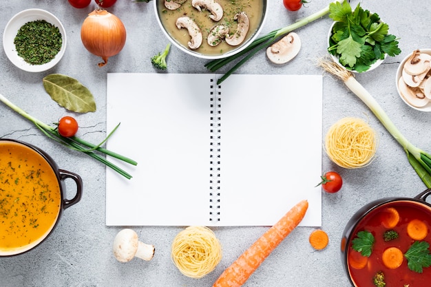 Soup and veggies arrangement flat lay