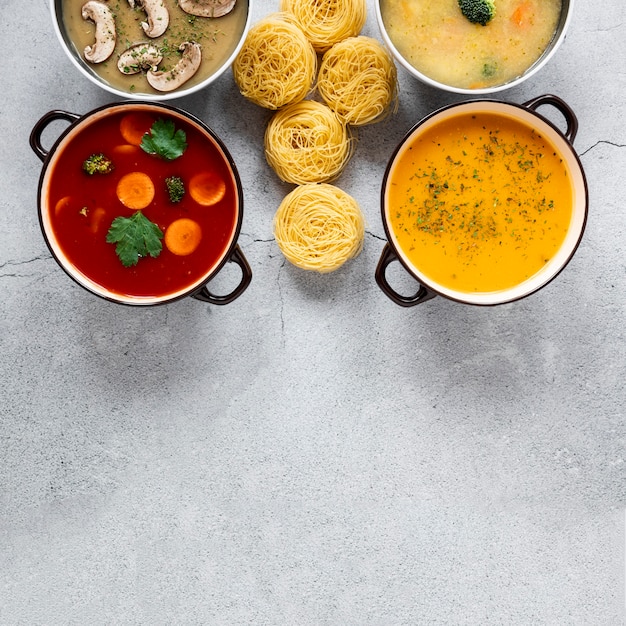 Soups and pasta rolls flat lay