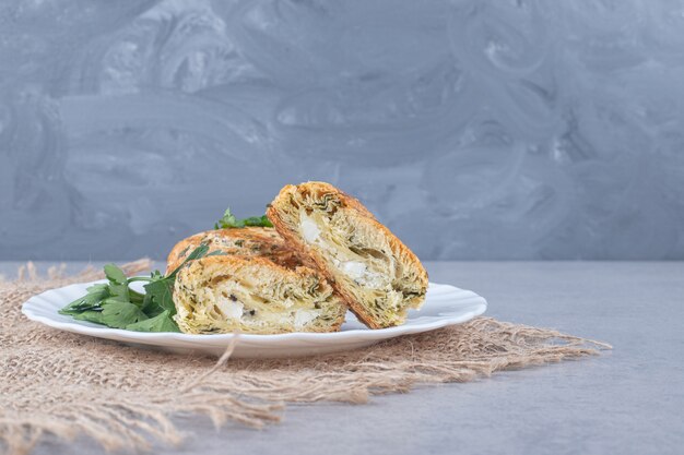 Sour gogals served on a platter with parsley garnish on marble