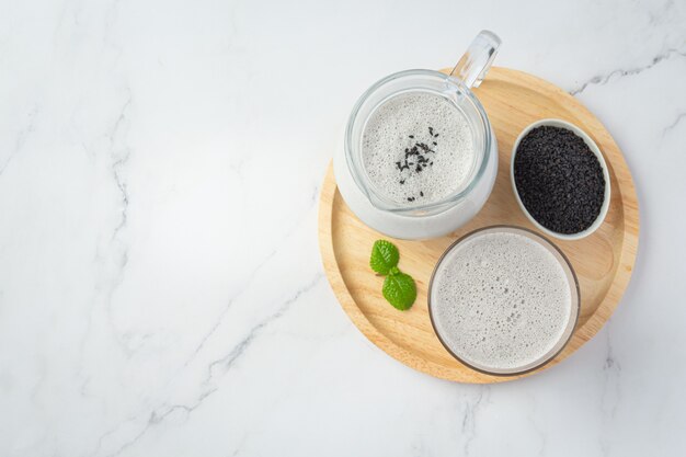 Soy milk mix black sesame on marble background