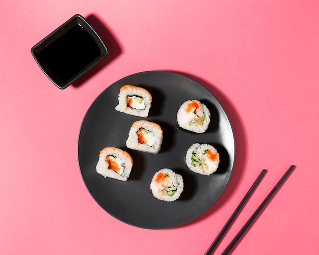 Soy sauce and sushi rolls