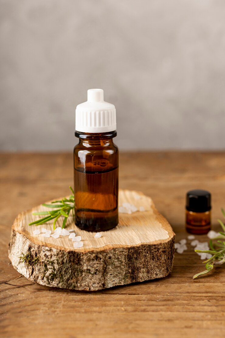 Free Photo spa arrangement with wood piece and oil