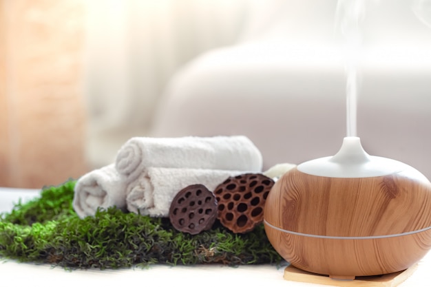 Free photo spa composition with the aroma of a modern oil diffuser with body care products