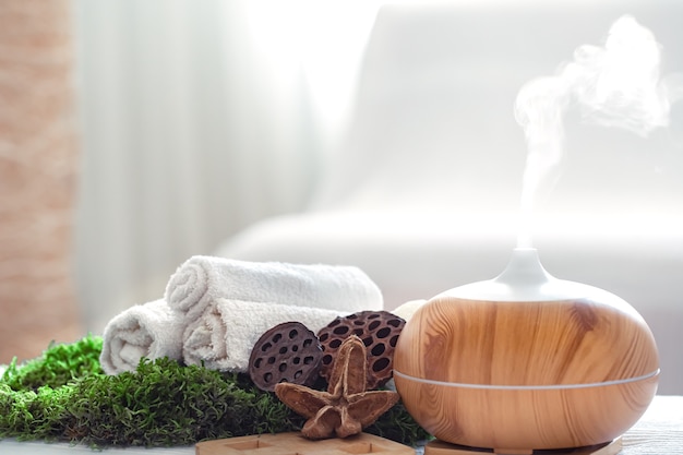 Spa composition with the aroma of a modern oil diffuser with body care products.