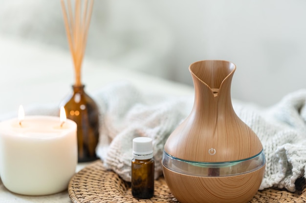 Free photo spa composition with aroma oil diffuser lamp on a blurred background