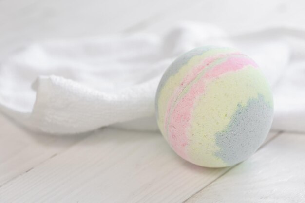 Spa composition with bath bomb and towel closeup