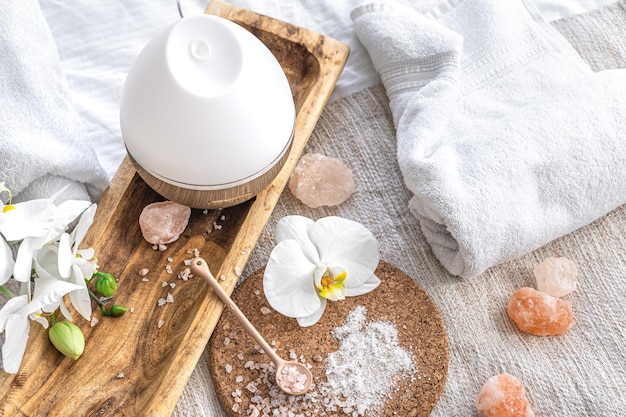 Spa composition with humidifier and flowers closeup health concept