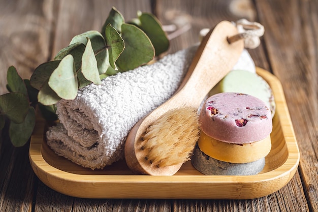 Free photo spa composition with soap brush and towel