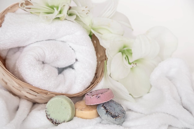 Free photo spa composition with towels lily flowers and handmade soap