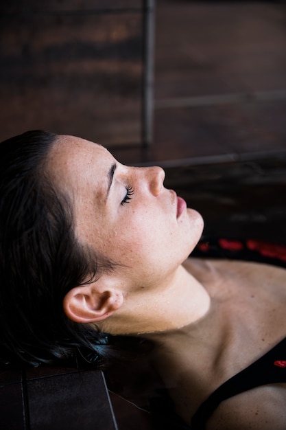 spa concept with woman relaxing in water