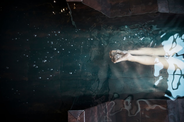 Spa concept with woman relaxing in water